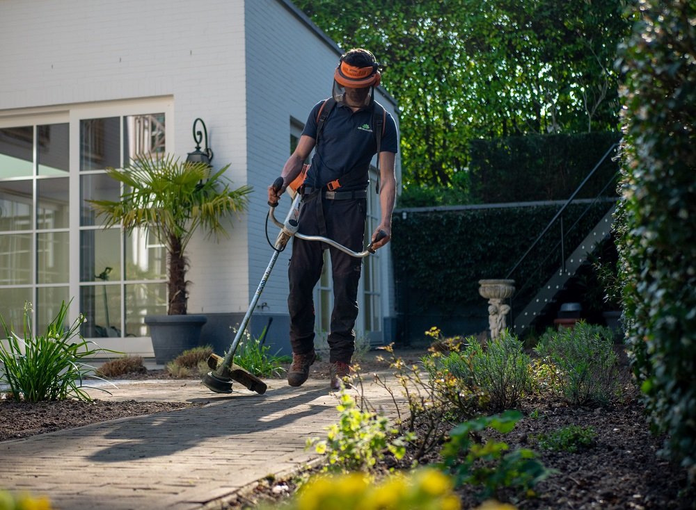 man with outdoor and garden equipment