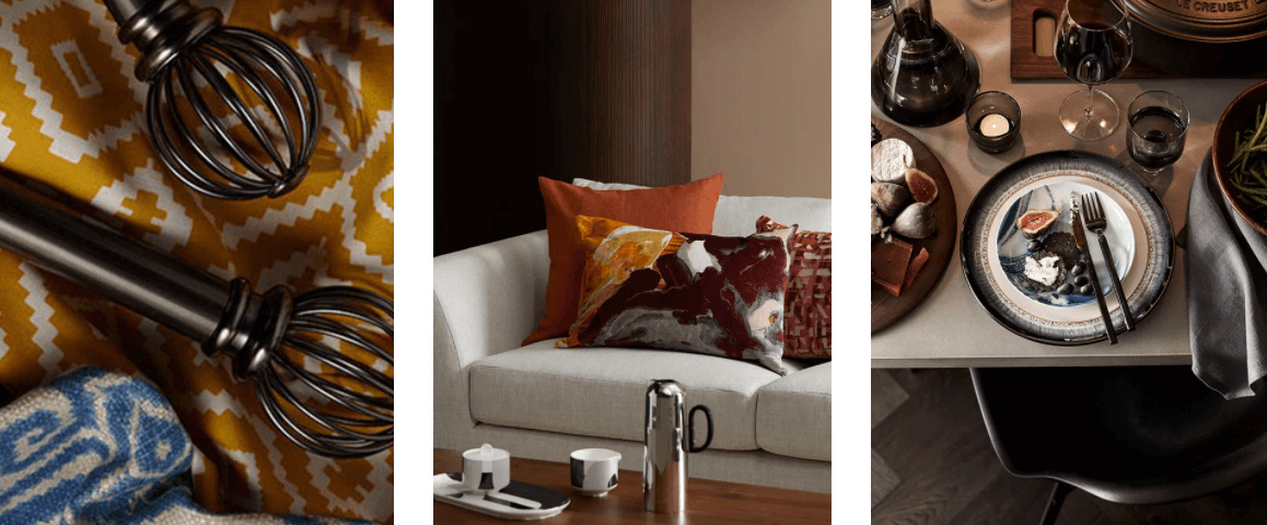 Ornate curtain rod, curtains, sofa with decorative cushions, and stylish crockery laid out on a table with a wine decanter