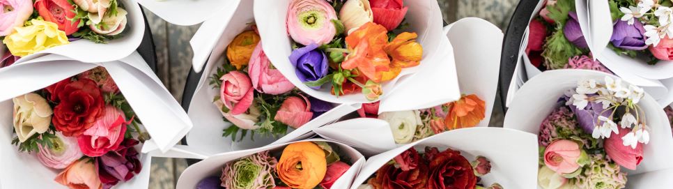 Bouquets of Mother&apos;s Day flowers on a wood decking
