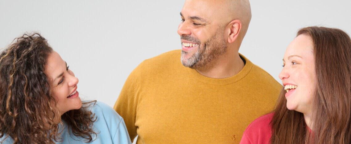 Numan how to save banner showing a man and two women laughing together