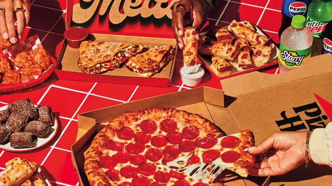 Hands Grabbing Pizza