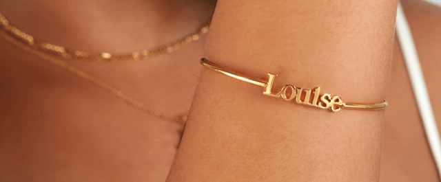Abbott Lyon savings guide banner. Image shows a gold bangle with the name Louise set into it