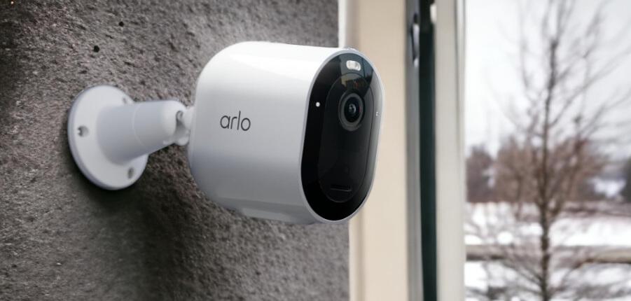 Arlo deals page banner showing a branded security camera on a wall