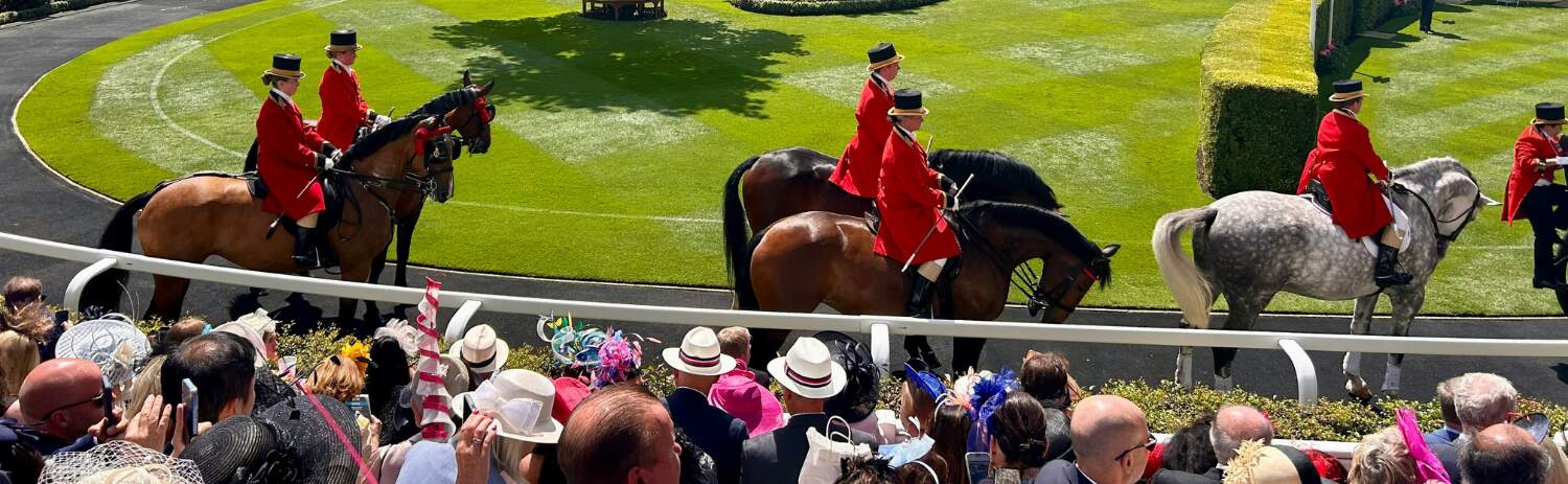 Ascot Royal Procession featuring red coated guards on horseback