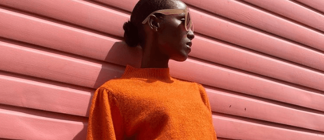 ASDA George – Woman wearing bright orange knitted jumper