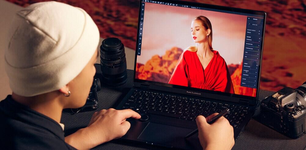 Asus savings guide banner - Image shows a person using a stylus pen on an Asus branded laptop