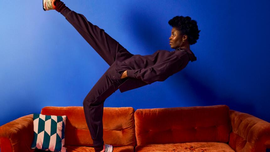 Woman wearing a purple loungewear set with hoodie and tracksuit trousers from BAM bamboo clothing