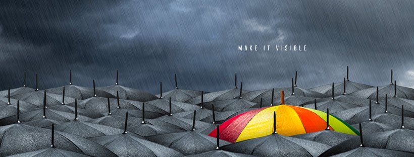 Bright colours umbrella among many grey umbrellas. Text reads: Make it visible