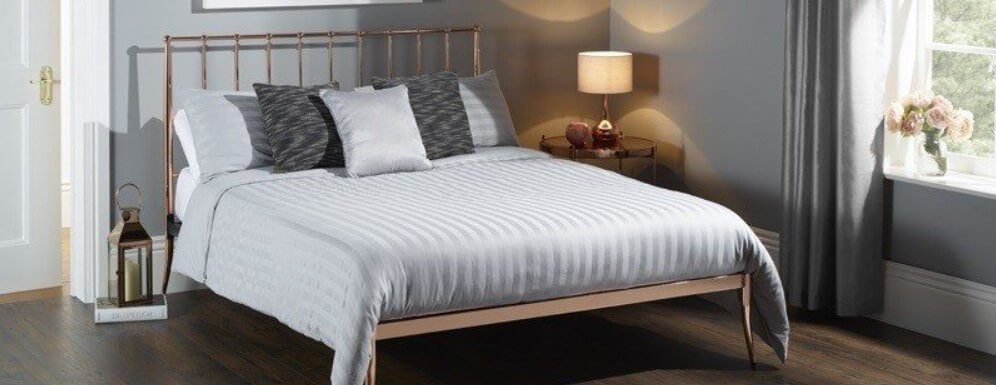 Bed Kingdom how to save money banner showing bed in a bedroom set-up
