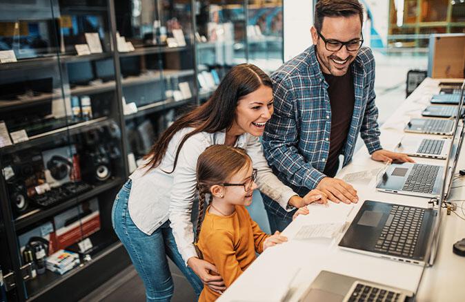 Family looking at laptops