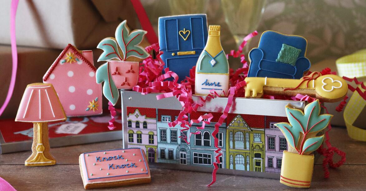 Biscuiteers savings page banner - A colourful biscuit assortment overflowing from a tin