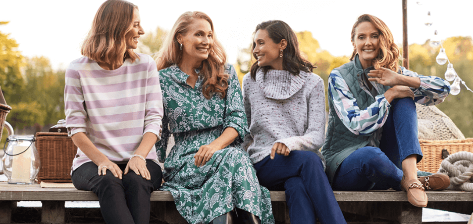 Black Pepper deals page banner - Four women wearing stylish clothing laughing and joking on a bench