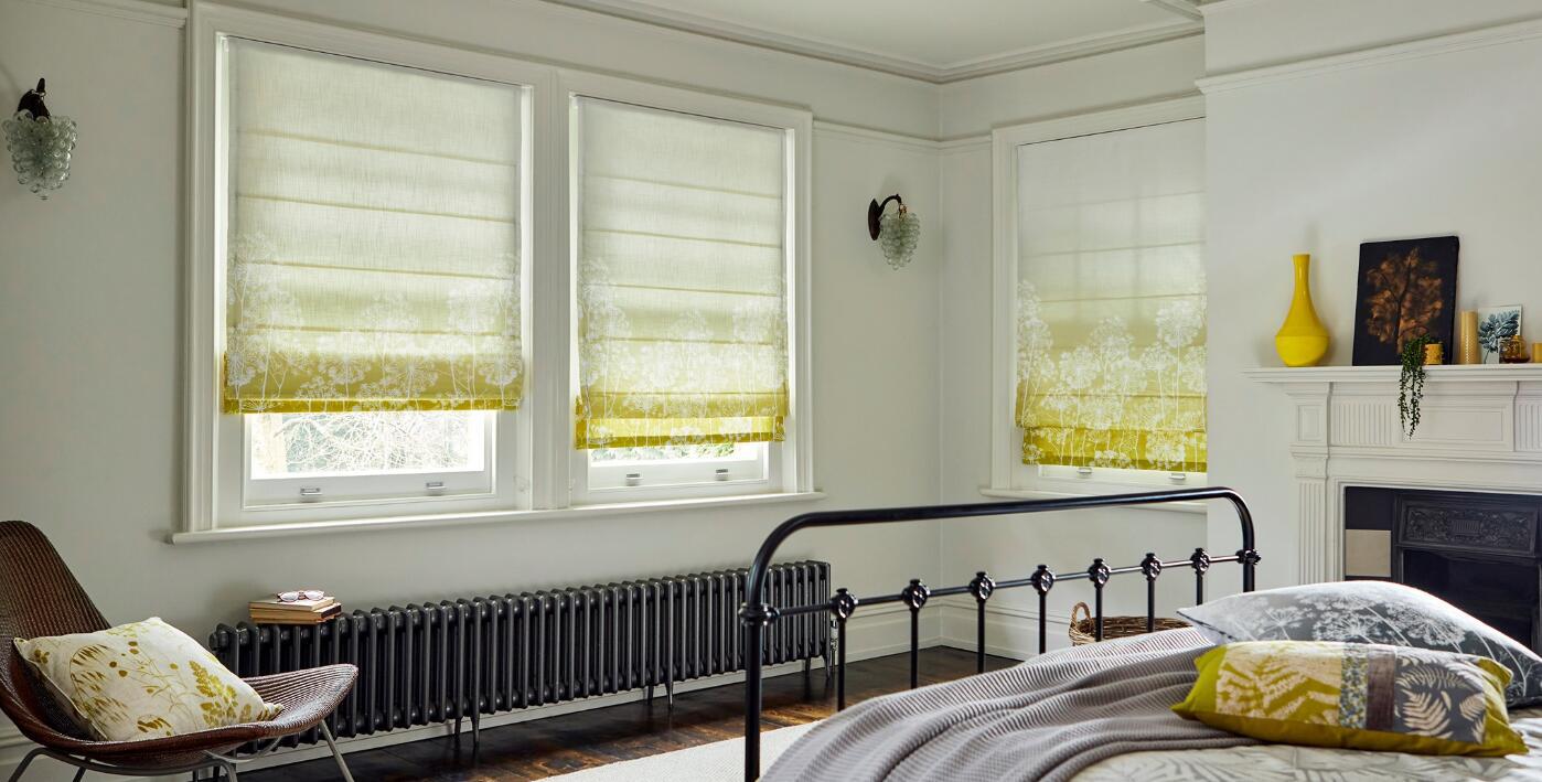Blinds2go savings tips banner featuring a light bedroom with prominant floral patterned blinds at the windows