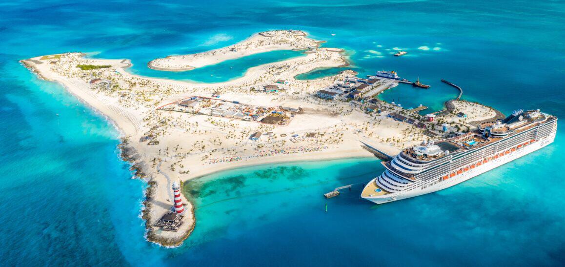 Blue Sea Holidays savings tips banner showing a cruise ship docked at a small island