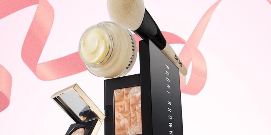 Bobbi Brown mothers day savings - Image shows a selection of branded beauty products with a pink ribbon wrapped around