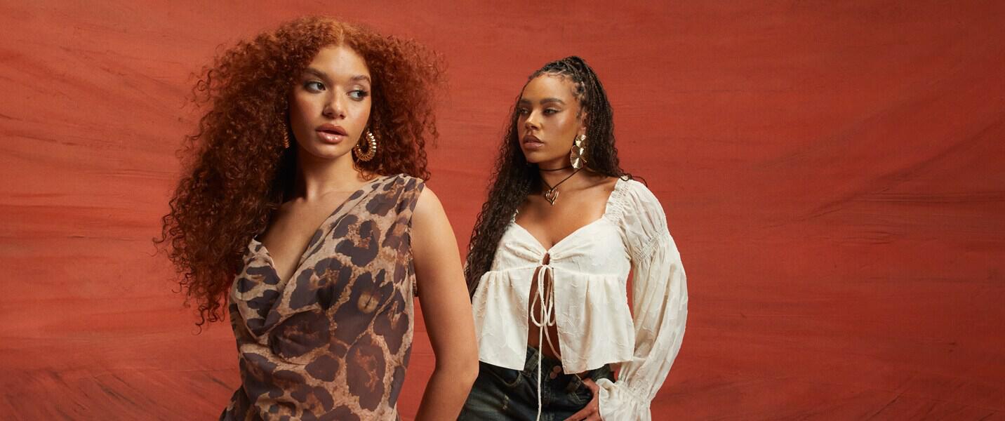 boohoo offers page banner showing 2 women wearing new season styles in front of a red background
