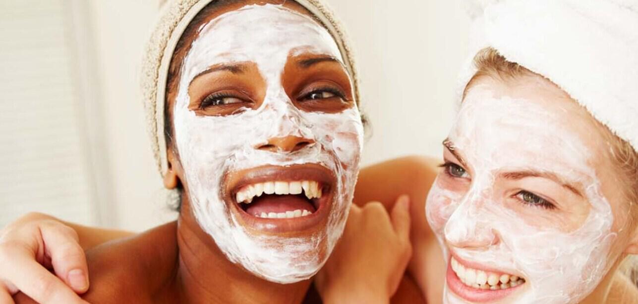 Boots seasonal deals image showing a close up of 2 women hugging  with cream covering their faces