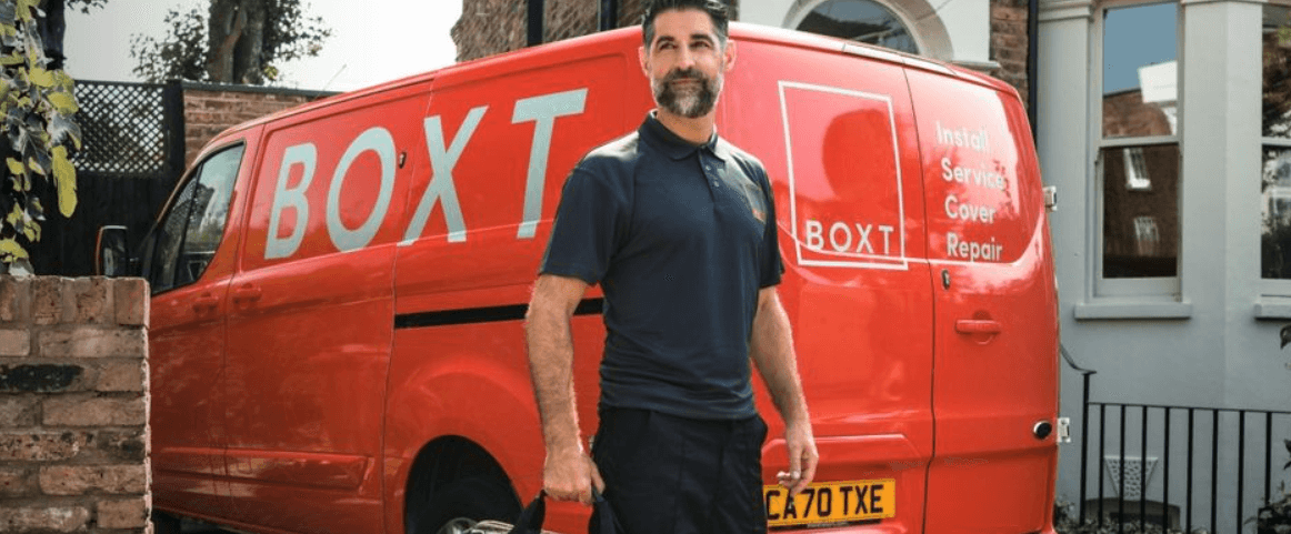 BOXT savings guide banner featuring a man standing in front of a red branded van