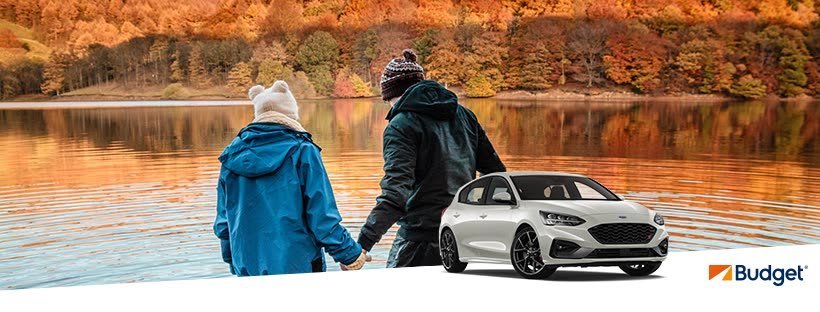 A couple enjoying a holiday rental car from Budget car rental