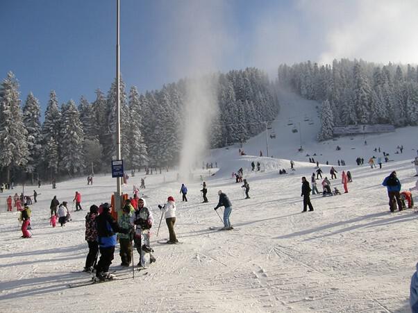 People skiing on the slopes of Borovets ski resort in Bulgaria