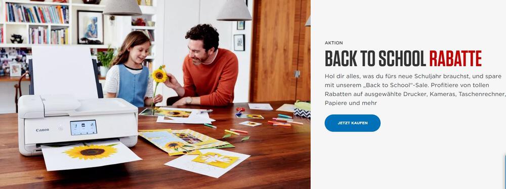 Canon Back to School Rabatte - Foto von Vater und Tochter, die Fotos einer Sonnenblume ausdrucken