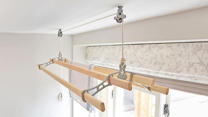 Cast In Style offers page image showing a ceiling clothes dryer in front of a window