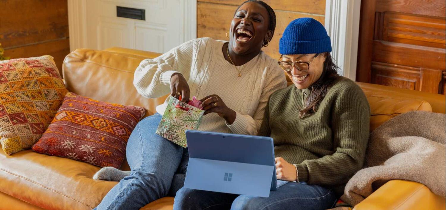 CCleaner ways to save banner. Image features 2 woman sitting on a sofa laughing in front of a laptop