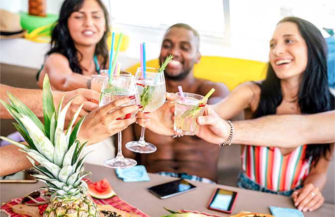 People touching drinks together