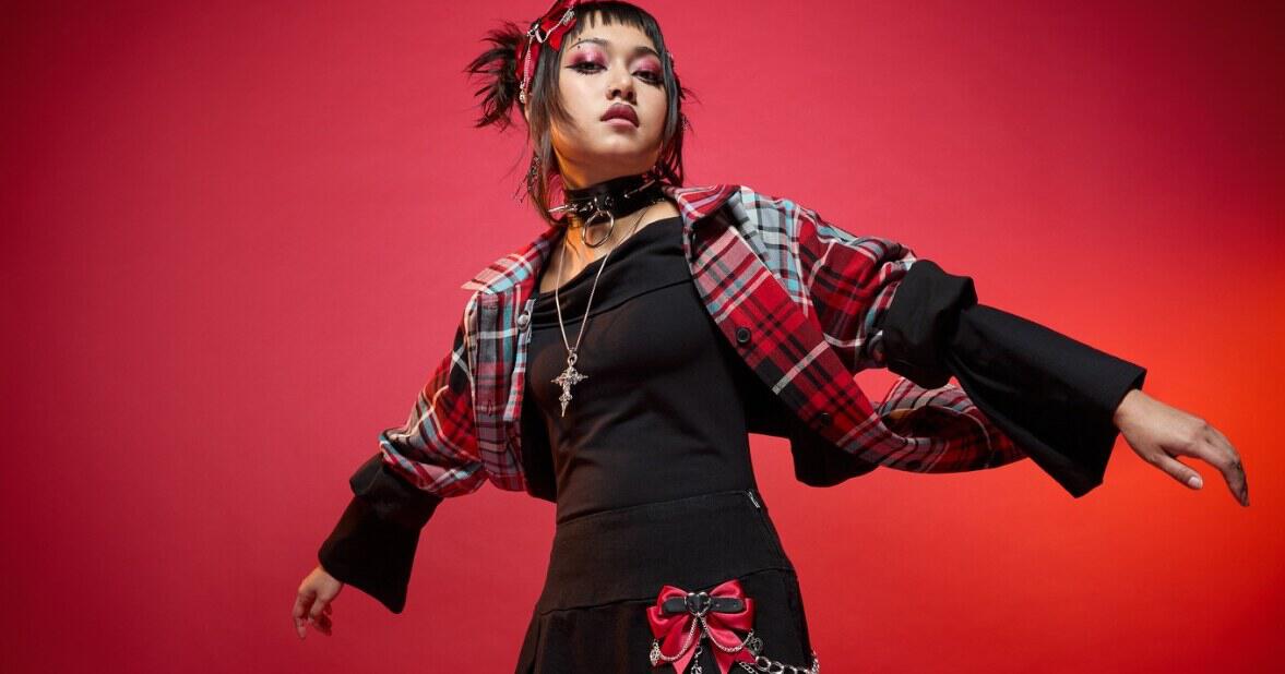 Dangerfield deals page banner showing a young woman wearing red and black gothic clothing against a red background