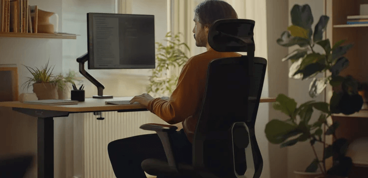 Desktronic offers page image showing a man sitting up to a computer screen
