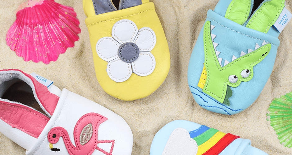 Dotty Fish offers page banner featuring vibrant childrens shoes on sand