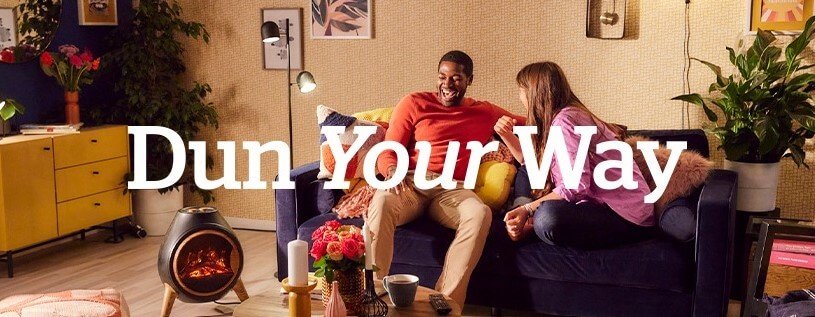 Dunelm how to save money banner featuring a man and woman sat on a sofa