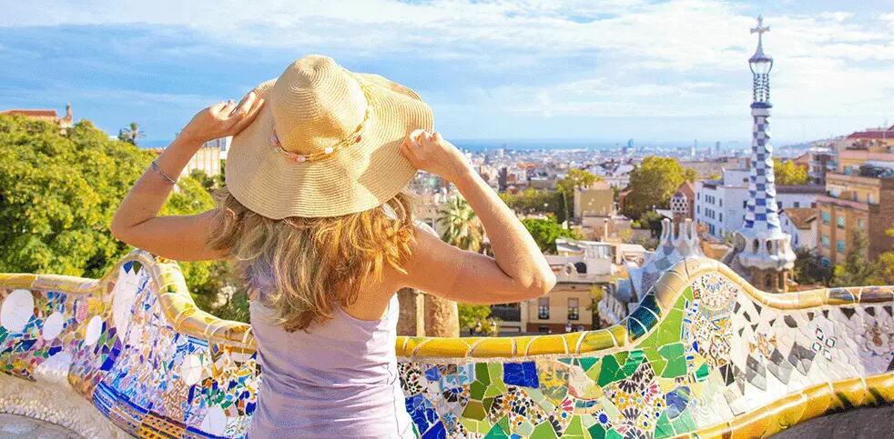 easyJet Holidays savings tips banner showing the back of a woman wearing a large hat in front of a scenic view of greece