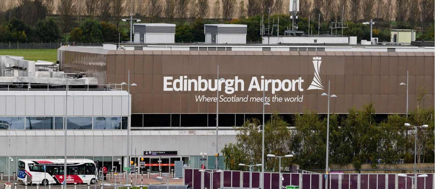 Edinburgh Airport discounts guide. Banner shows the exterior of the airport featuring large sign
