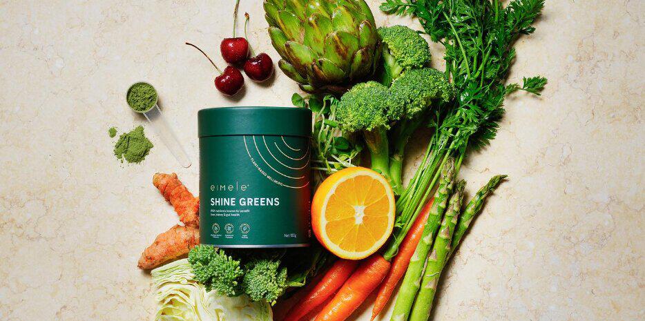 Eimele deals page image - A jar of Shine Greens next to vegetables and fruit