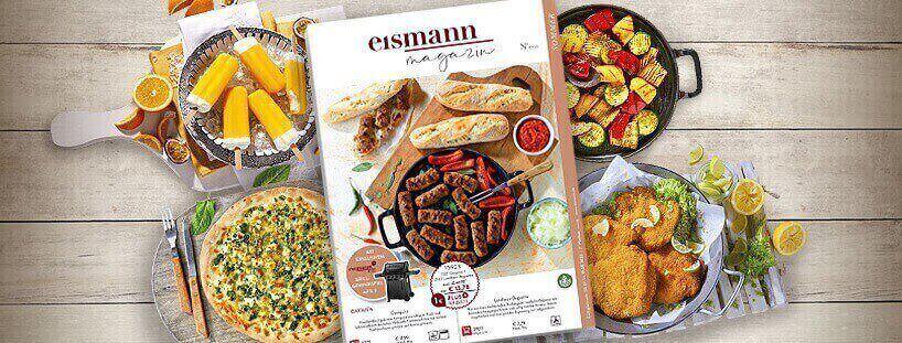 Banner der eismann Gutscheinseite: das eismann Magazin vor einer Auswahl an Fertiggerichten auf einem Holztisch