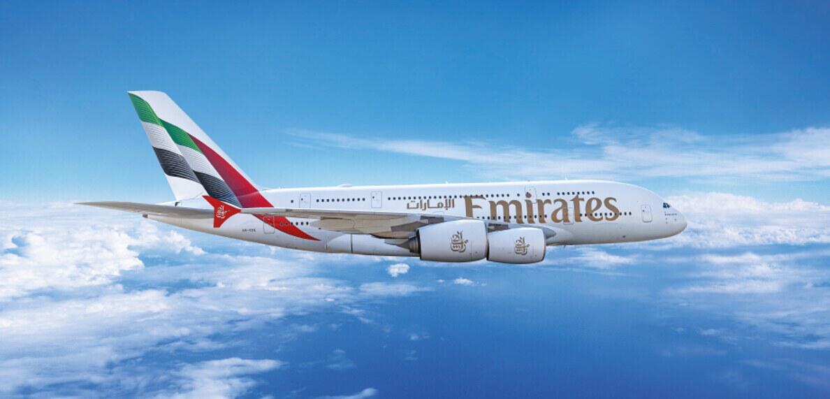 Emirates plane in flight image