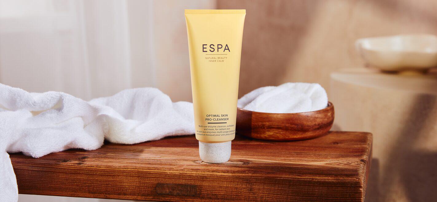 ESPA savings banner showing a tube of optimal kin pro-cleanser and white towel in a wooden table top