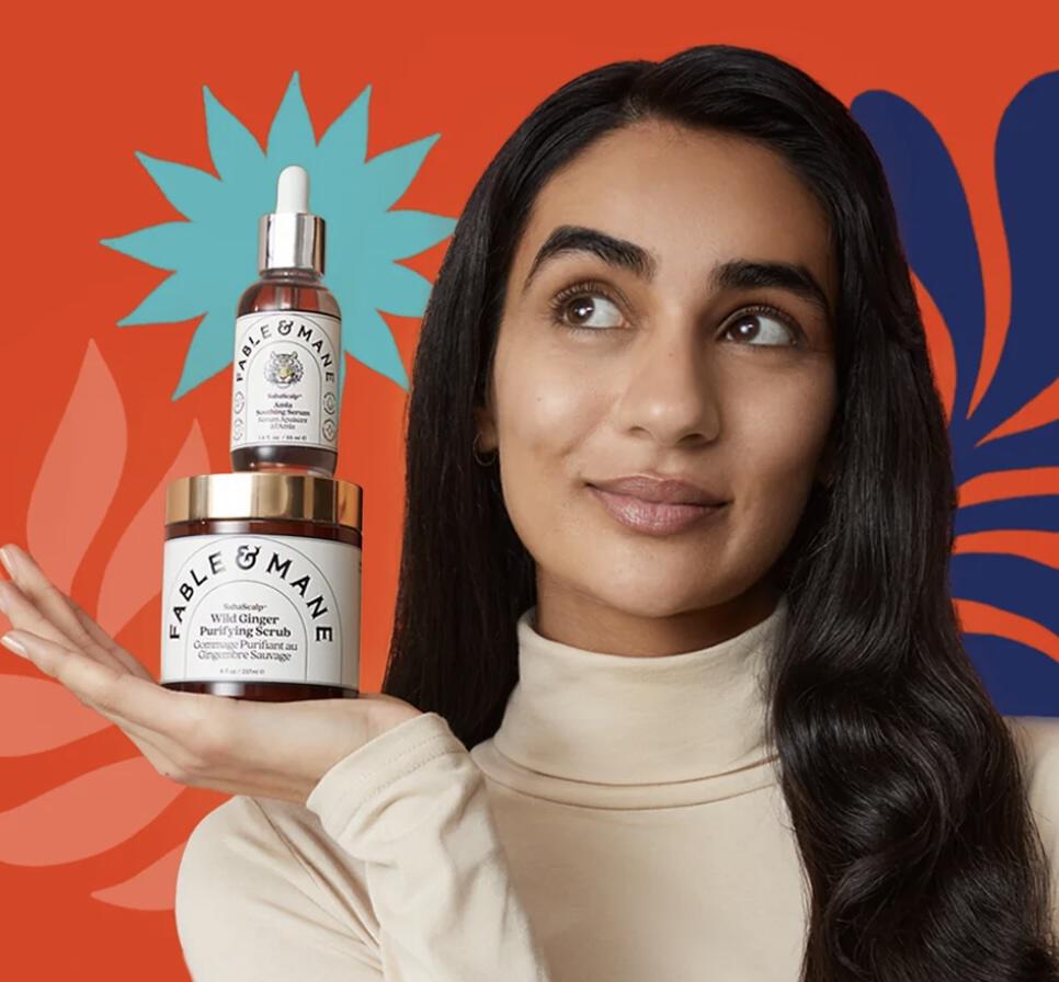 girl holding fable and mane products