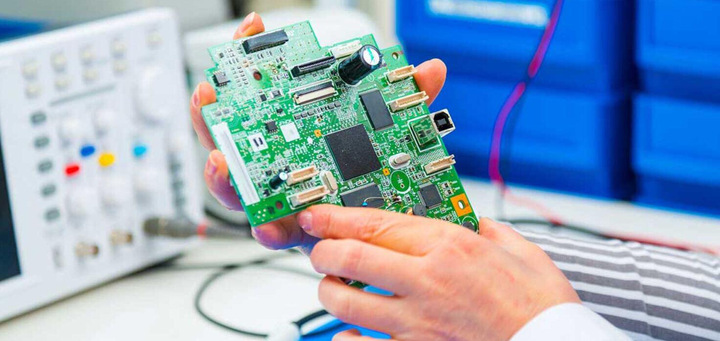 Farnell savings guide featuring a hand holiding a computer motherboard