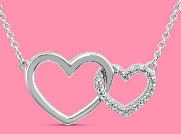 Image of 2 interlocking silver hearts on a pink background