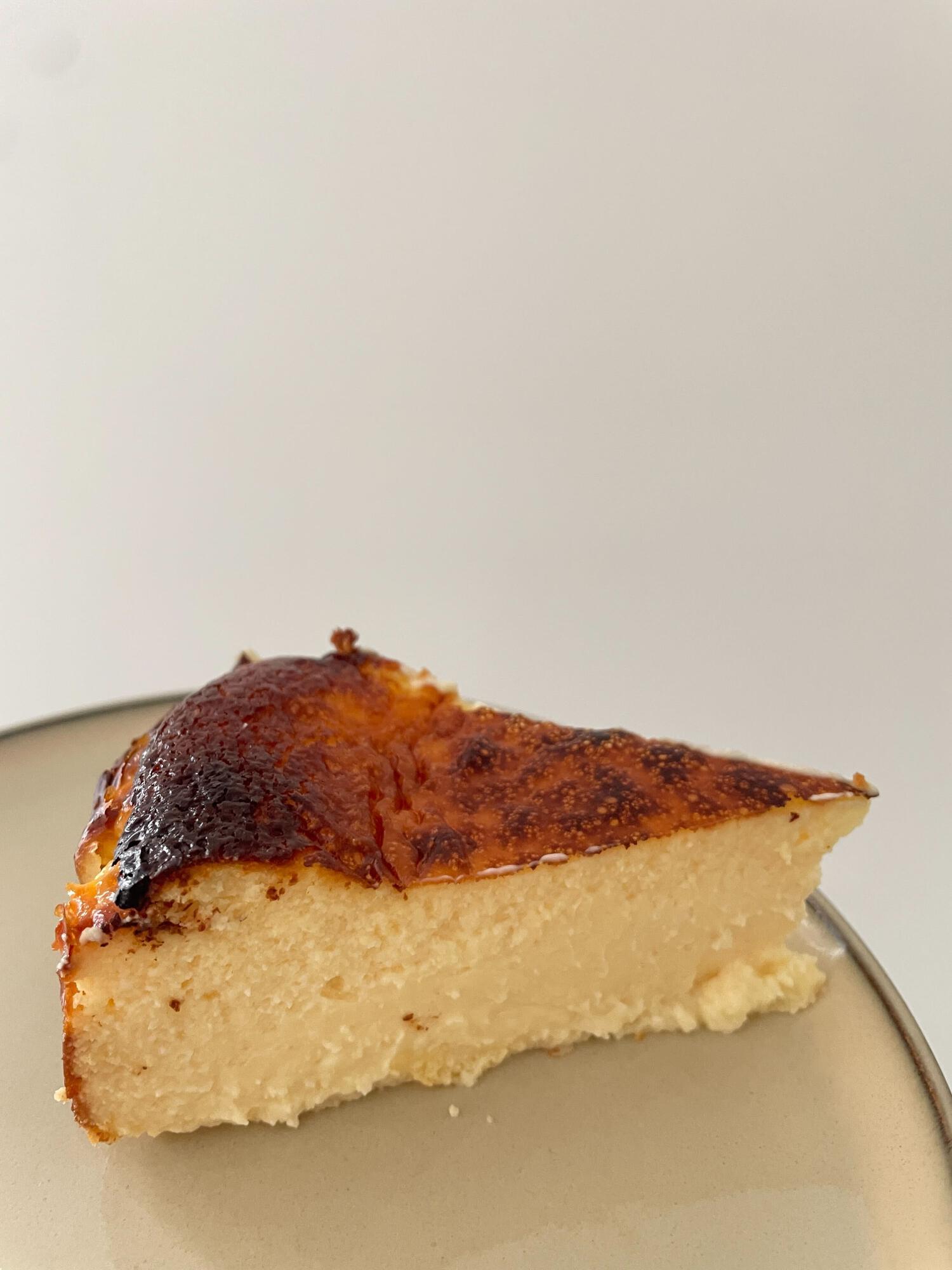 Side view of slice of burnt basque cheesecake
