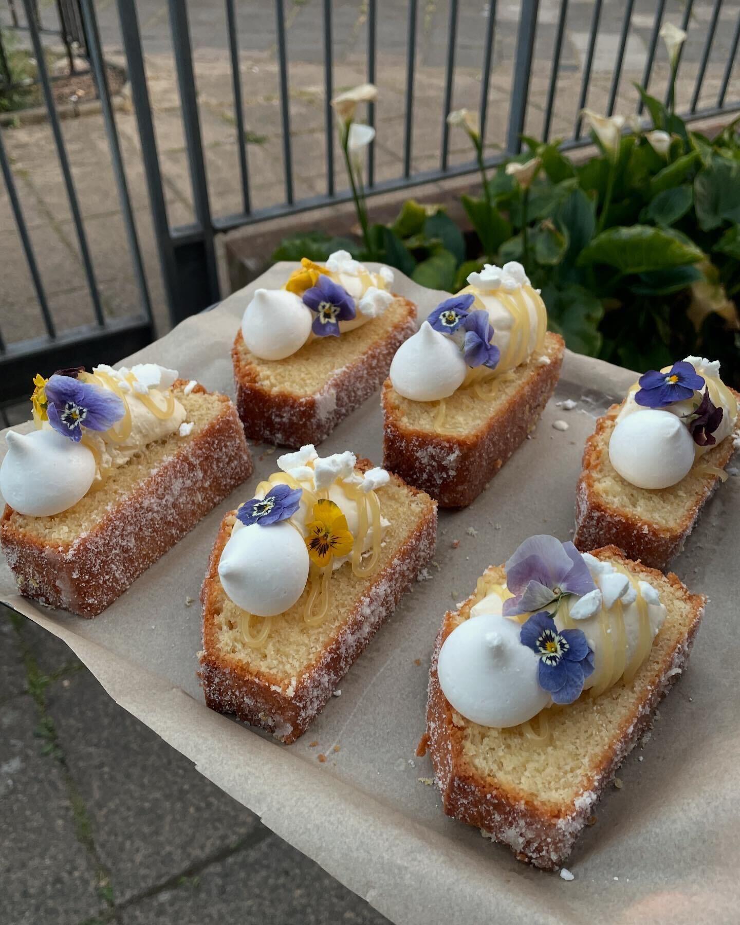 Lemon curd cake slices decorated with flowers and meringue from different angle
