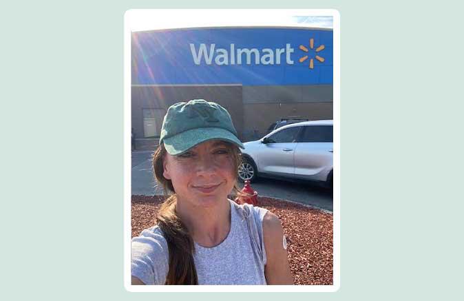 Woman outside Walmart with a bandage on her arm