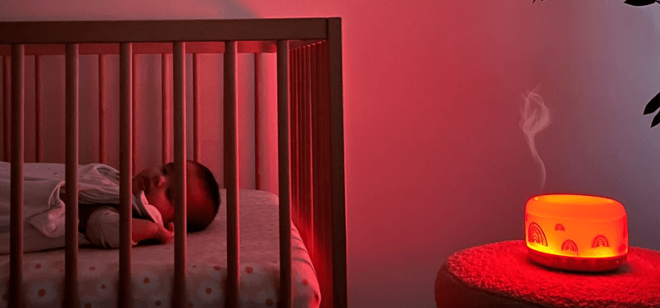 Glow Dreaming deals page banner - A baby sleeping in a cot next to a light device providing a warm glow