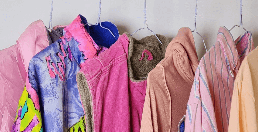 Go Thrift page banner - Image shows a selection of pink clothing on a rail