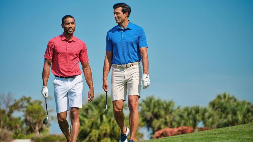 Greg Norman men in polos playing golf