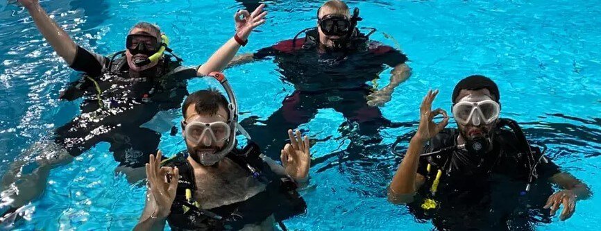 Groupon new activities for less banner showing 4 scuba divers in pool