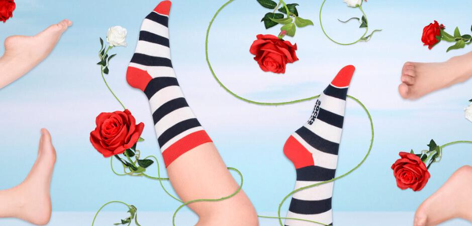 Happy Socks deals page picture featuring black, white and red socks on a blue background