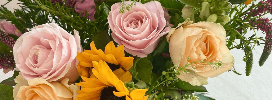 Haute Florist savings guide banner featuring pink and yellow flowers